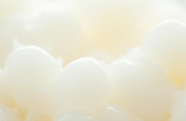 Close-up of molten wax texture or quality wax pellets