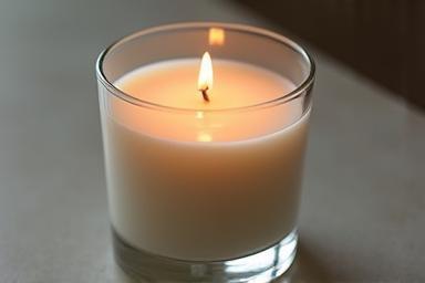 Elegant scented candle in a glass jar